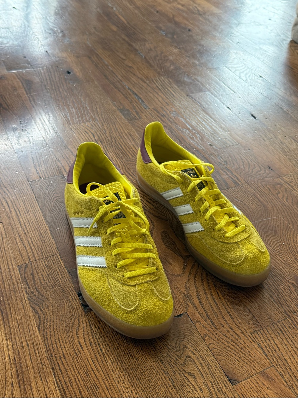 adidas women’s Yellow Suede Sneakers with White Stripes